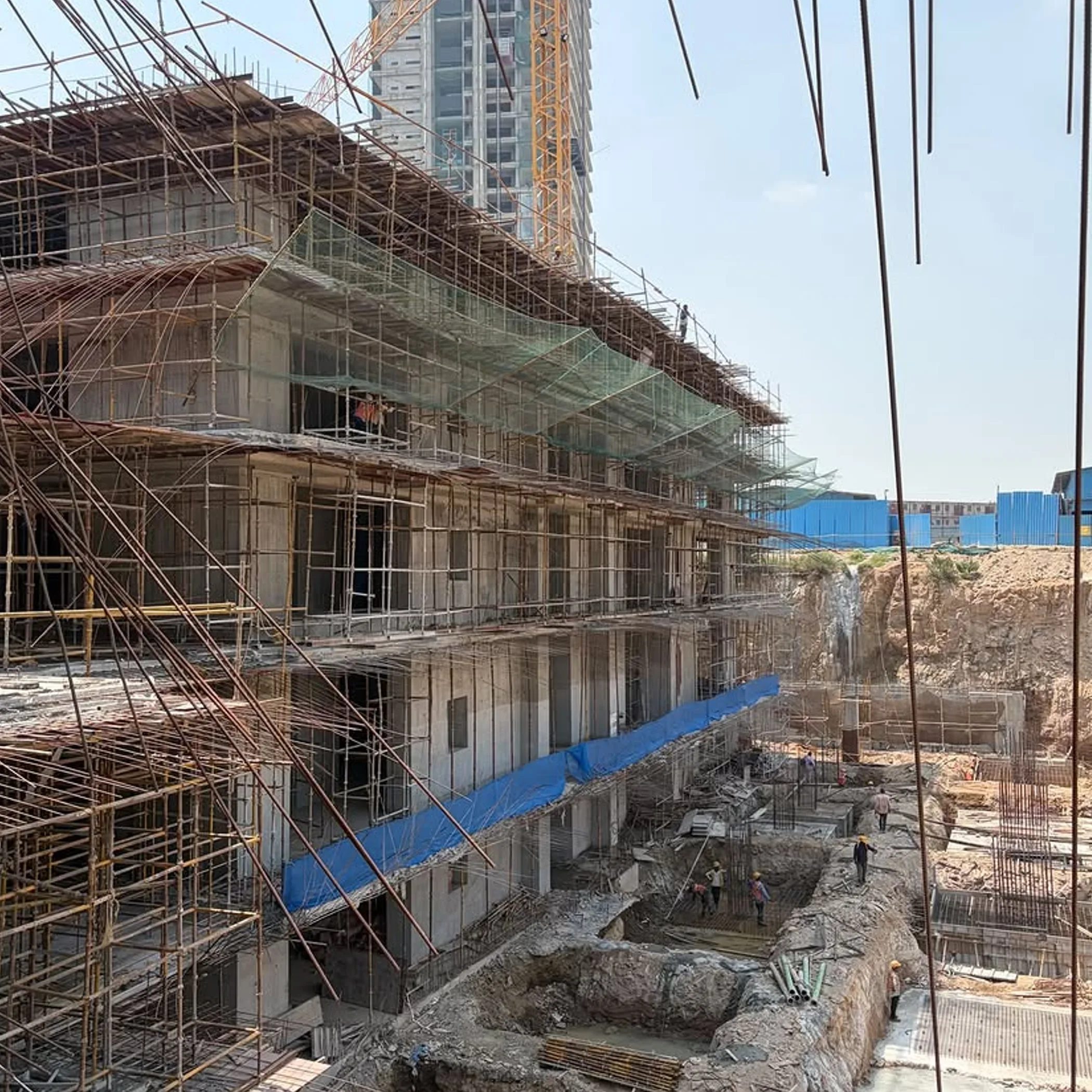 high-rise scaffolding and workers