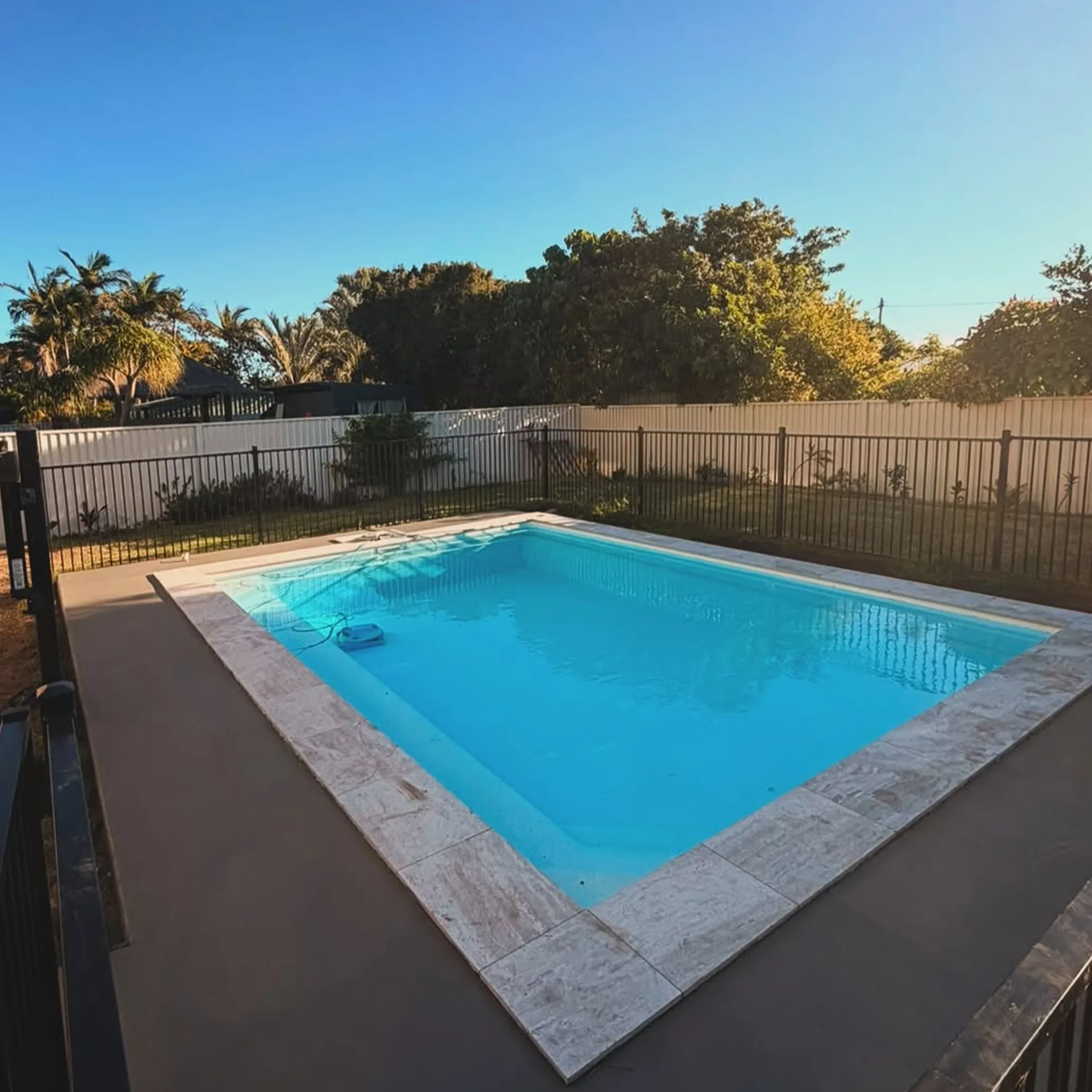 sunny outdoor poolside concrete